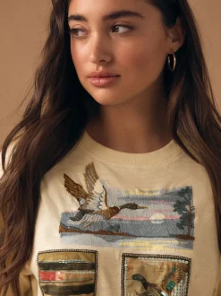 Beurre jaune - T-shirt à manches courtes à manches courtes et col ras du cou avec écusson à sequins