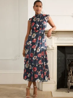 Bleu marine à fleurs - Robe longue imprimée à col haut et à volants