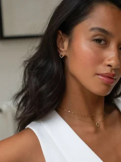 Boucles d’oreilles D.louise imperméables avec clous de trèfle