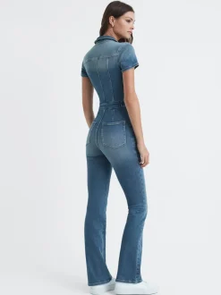 Combinaison en denim Good American évasée en bas