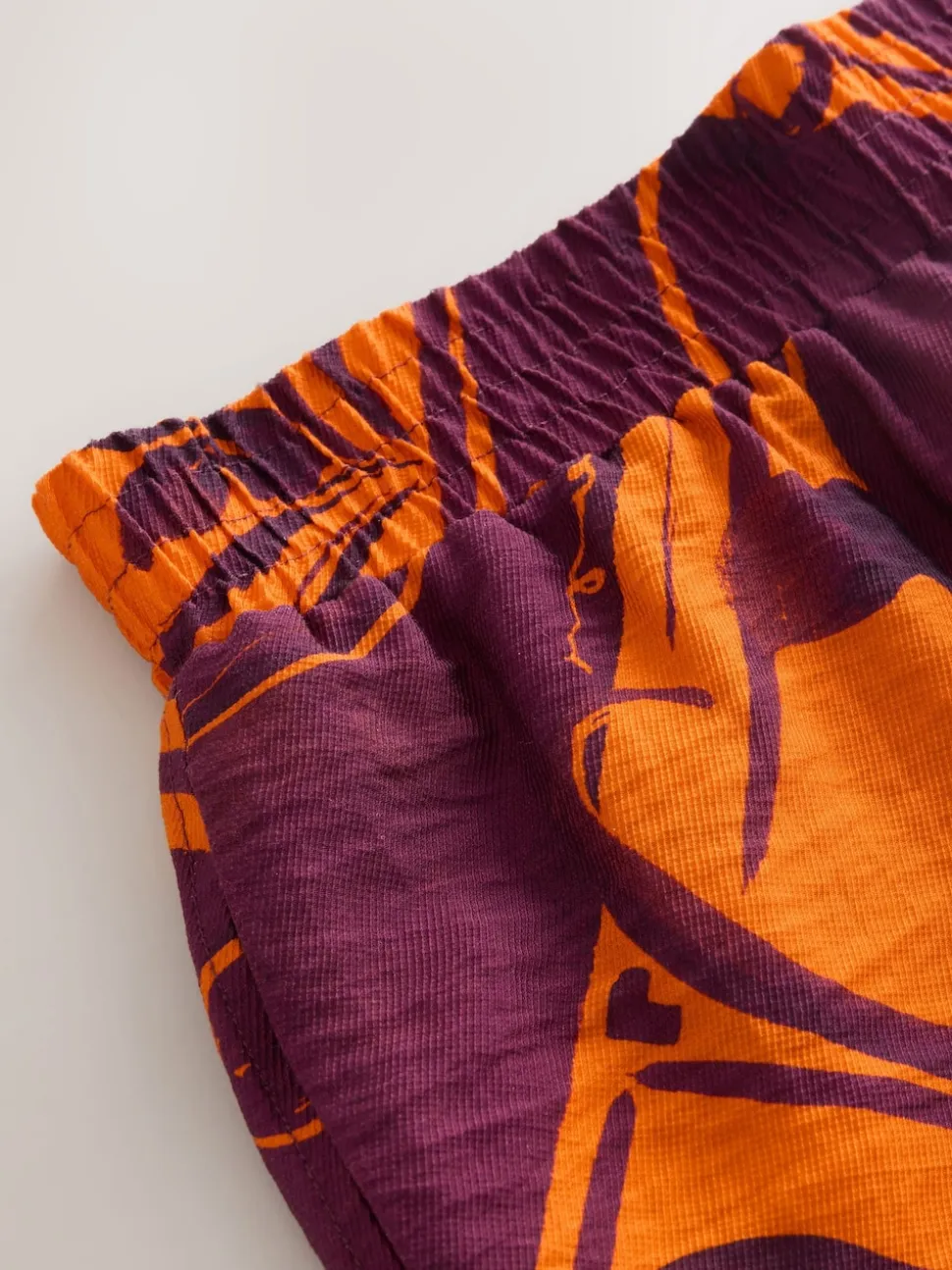 Imprimé bordures exotiques orange/bordeaux - Short de villégiature à taille élastique