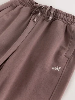 Marron - soi-même. Jogging à poignets