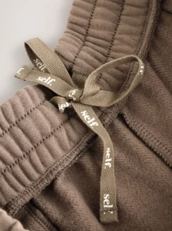 Marron mink - soi-même. Pantalon de jogging coupe large