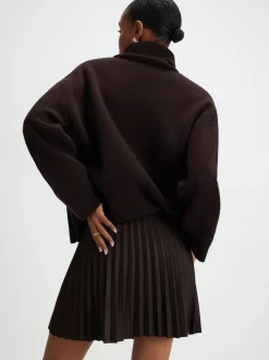 Mini-jupe plissée River Island en suédine à boutons