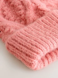 Rose corail - Chapeau à pompon en maille torsadée