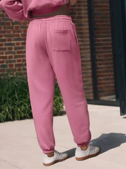 Rose vif - soi-même. Jogging à poignets