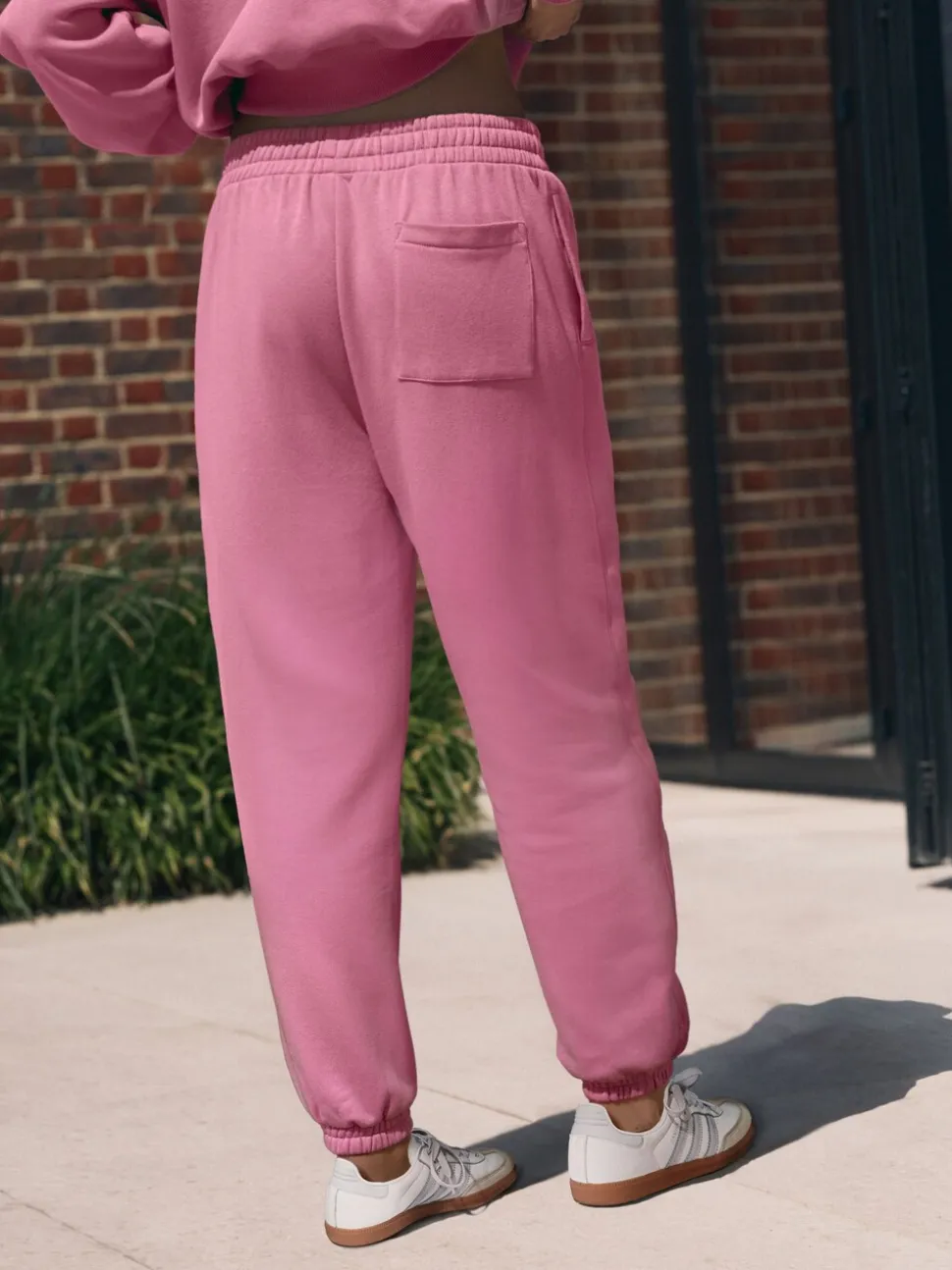 Rose vif - soi-même. Jogging à poignets