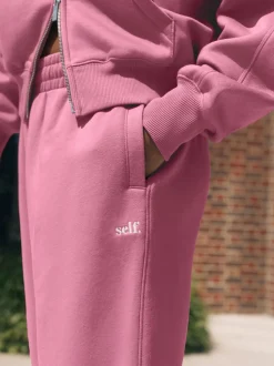 Rose vif - soi-même. Jogging à poignets