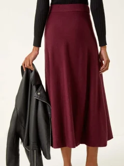 Rouge - Jupe mi-longue Roman en maille brillante