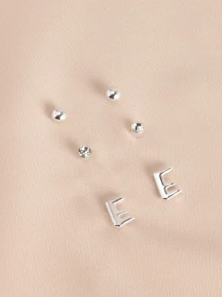 Tonalité argentée - Lot de boucles d’oreilles initiales