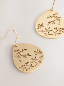Tonalité d'or - Boucles d’oreilles pendantes avec détail fleuri