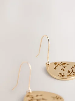 Tonalité d'or - Boucles d’oreilles pendantes avec détail fleuri