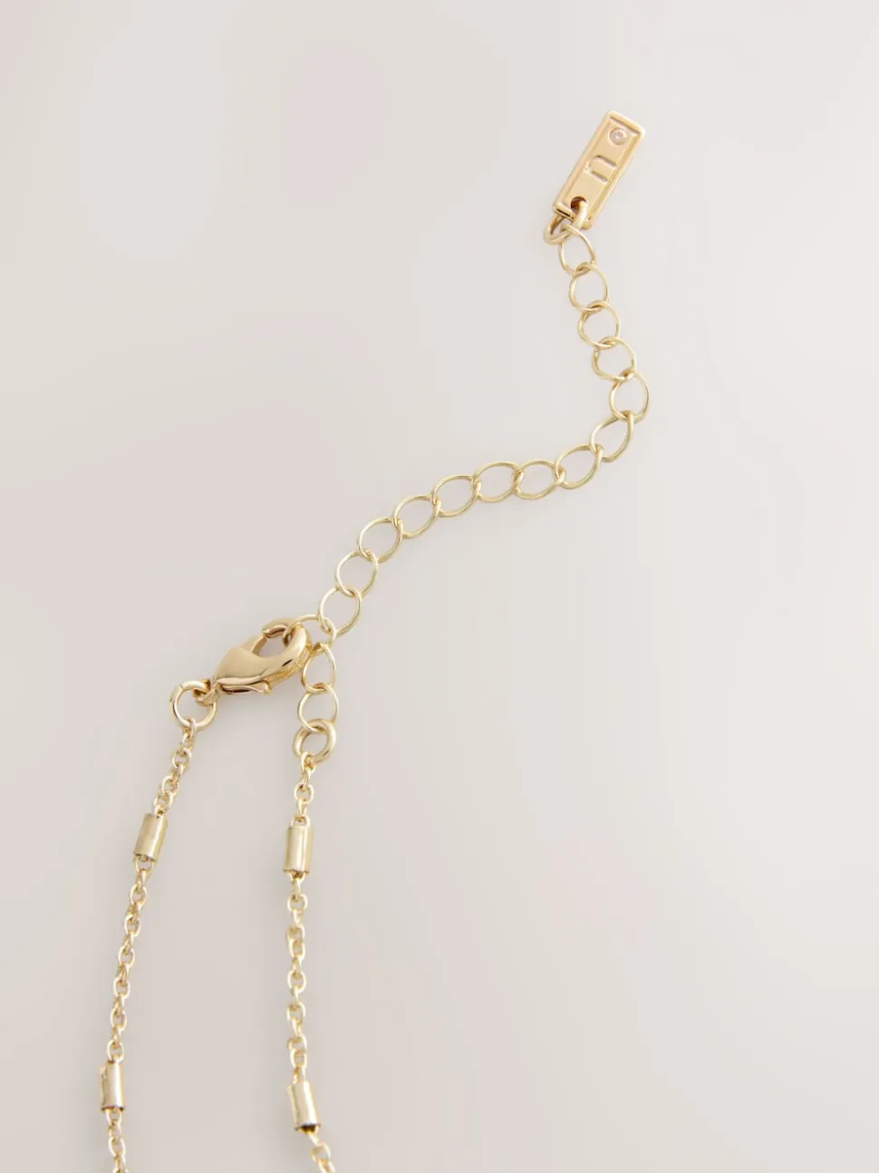 Tonalité d'or - Collier à médaillon cœur