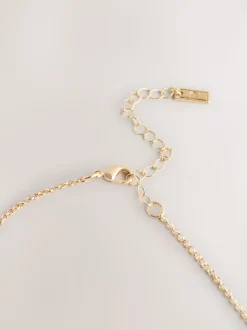 Tonalité d'or - Collier à pendentif cerceau empilé