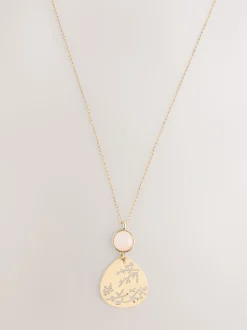 Tonalité d'or - Collier avec pendentif détail fleuri