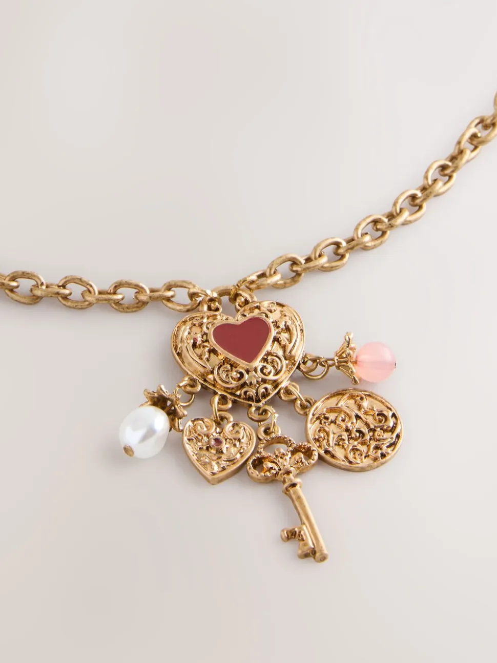 Tonalité d'or - Collier long à breloque cœur en grappe