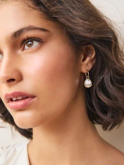 Tonalité or/argent - Boucles d’oreilles créoles à facettes